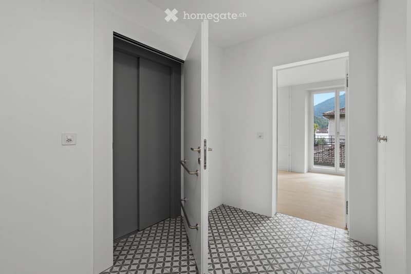 modern interior, elevator, open door, parquet floor, white walls, tiled floor, balcony view