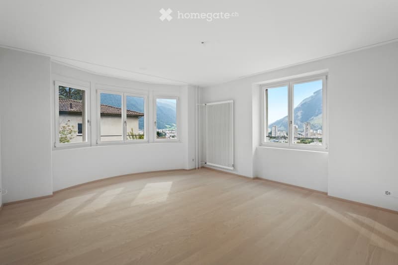 large windows, wooden floor, white walls