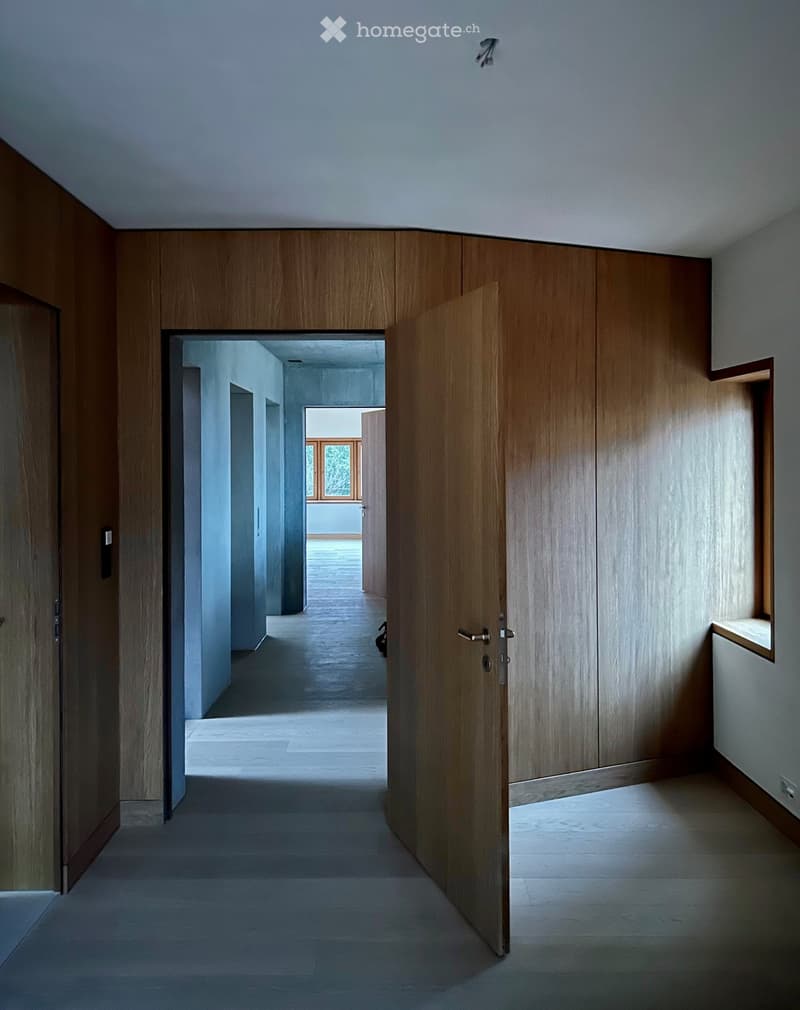 wooden wall panels, tiled floor, doorways, glass window