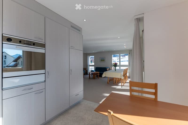 modern kitchen, wooden dining table, built-in oven, dining chairs, floor lamps, window