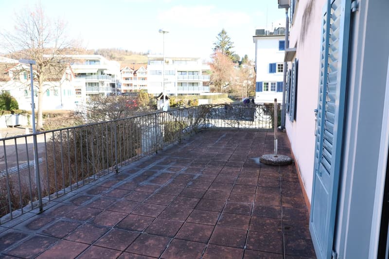 tiled floor, metal railing, street lamp, street view