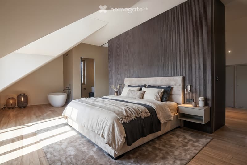 Bed, pillows, blanket, bedside tables, carpet, wooden floor, wooden wall, window, lamp, vase, basin