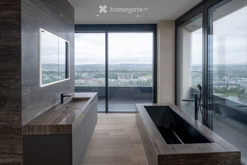 modern bathroom with marble wall, large windows, bathtub, sink, faucet, wooden floor
