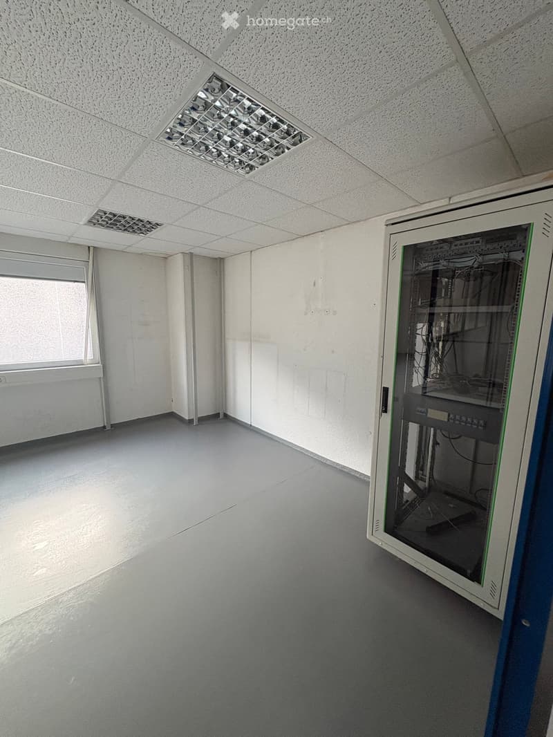 empty room, white walls, gray floor, window, server rack