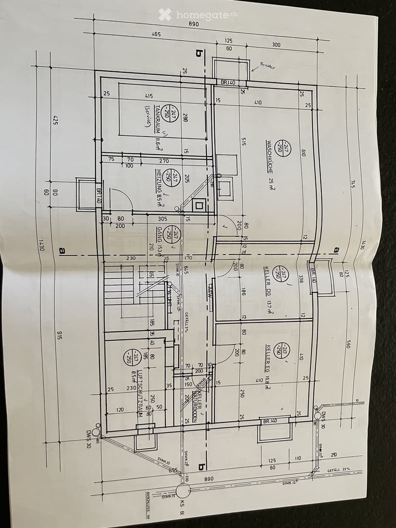 Floor plan of a multi-level building showing living room, kitchen, bedrooms, bathrooms, and basement areas with labeled dimensions and room labels.