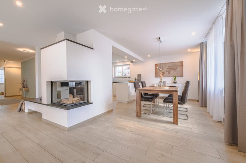 modern interior, fireplace, dining table, chairs, wooden floor, white walls, kitchen in background