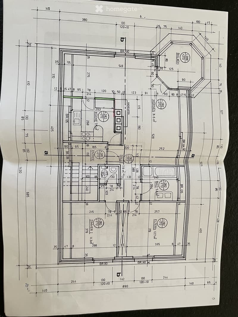Floor plan showing a multi-room layout with labeled dimensions, including a kitchen, living room, bedrooms, and a balcony.
