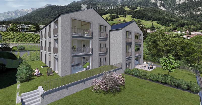 3 story apartment building, balconies, green surroundings, mountain view