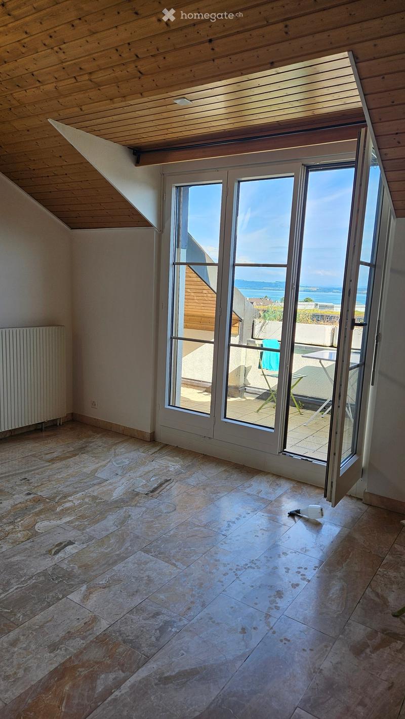 empty room, large windows, balcony, wooden ceiling, tiled floor