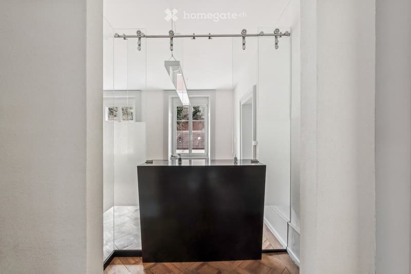 modern room, white walls, black desk, glass wall, wooden floor