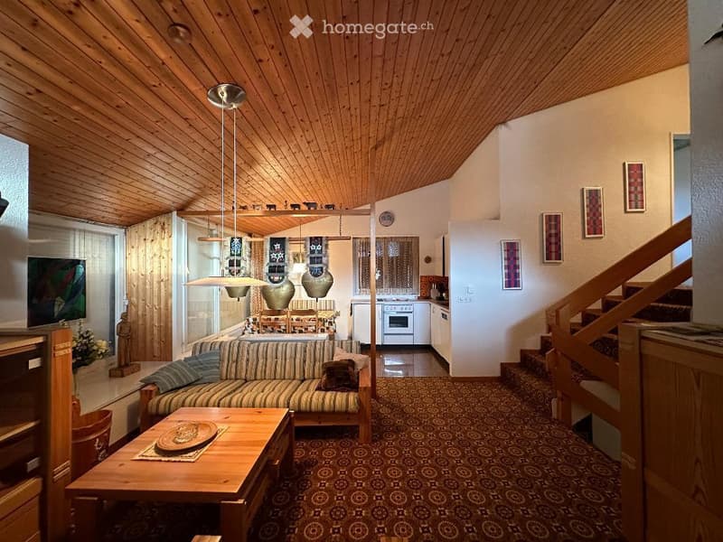 living room with wooden ceiling, carpeted floor, couch, coffee table, dining area, kitchen, staircase