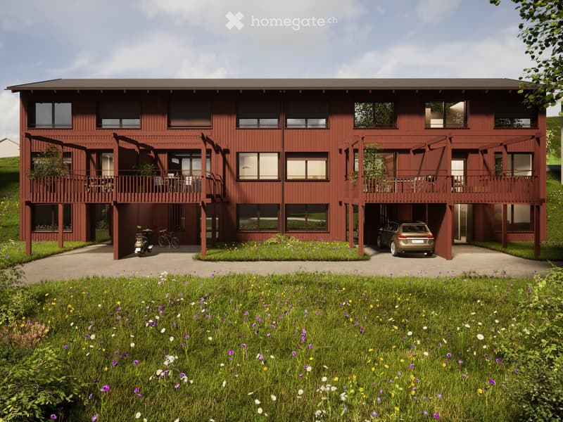 2 story house, red exterior, multiple balconies, garage, bicycles parked