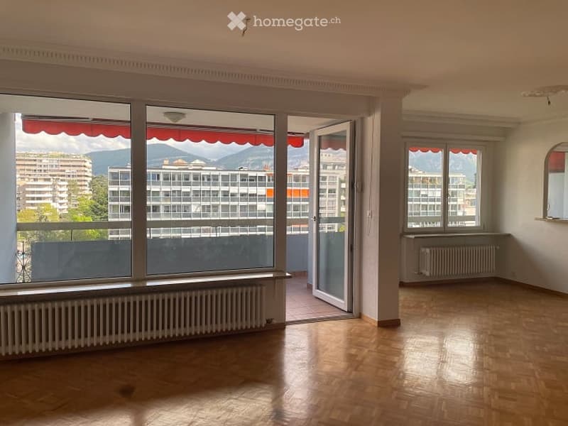 large windows, balcony, wooden floor, radiators, open door