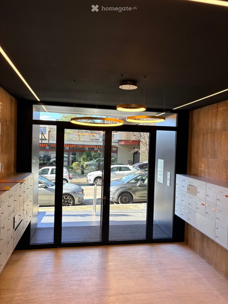 wooden walls, glass doors, mailboxes, wooden floor, lamps