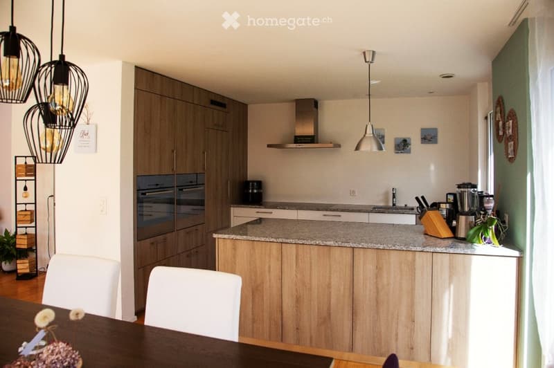modern kitchen, wooden cabinets, granite countertop, island, oven, stove, extractor hood, kitchen appliances, dining table, white chairs