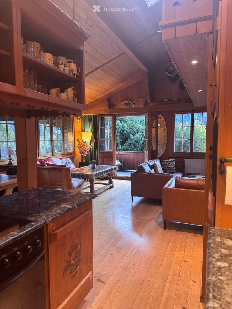 wooden interior, large windows, wooden floor, wooden furniture, fireplace, kitchen area, living area, dining area