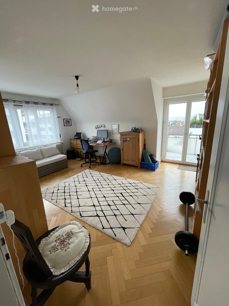wooden floor, white walls, desk, computer, chair, couch, rug, window, balcony, view