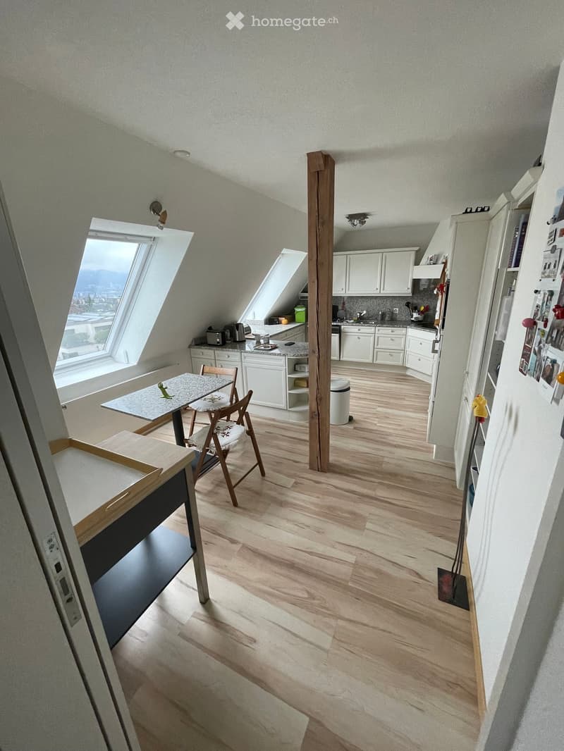 open kitchen, dining table, wooden floor, white cabinets, window, attic