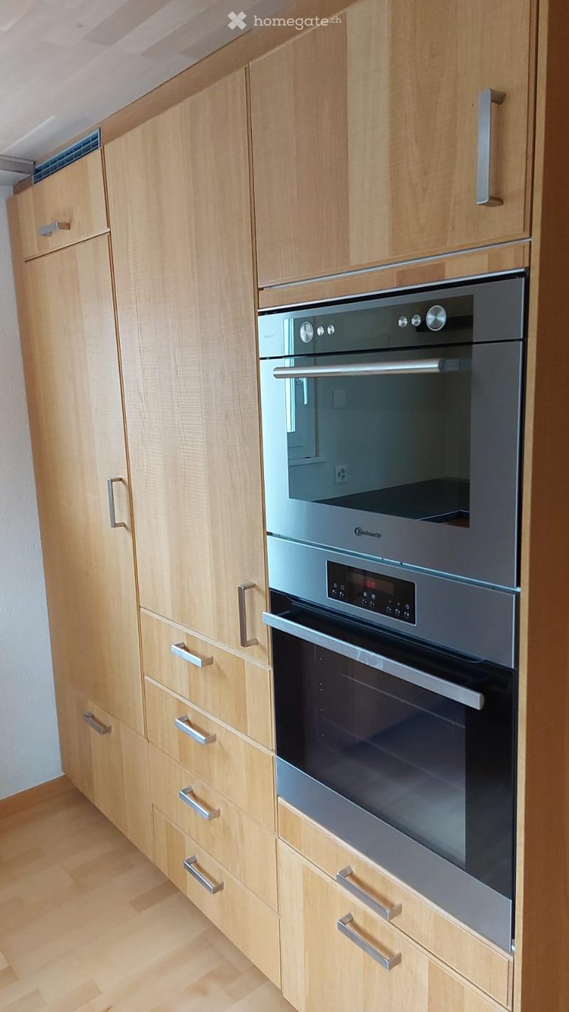 kitchen with wooden cabinets, stainless steel oven, dishwasher