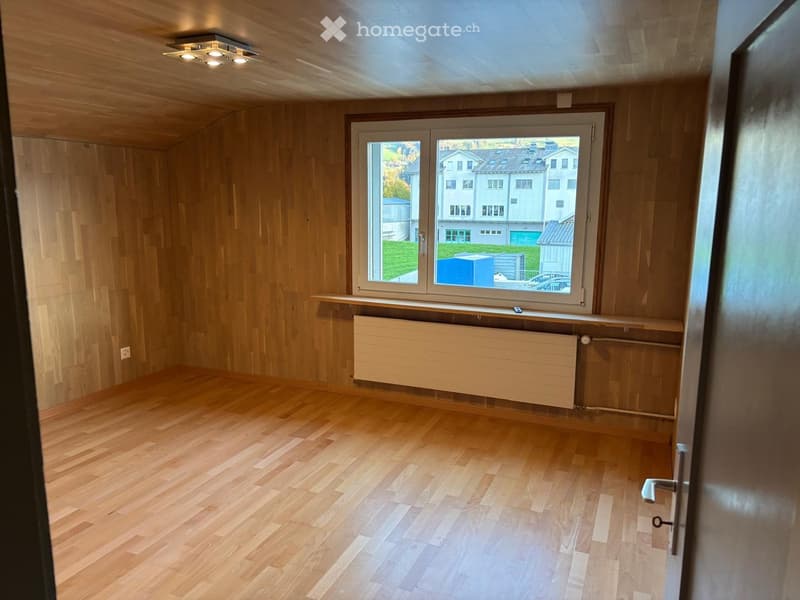 empty room, wooden floor, wooden walls, large window, radiator
