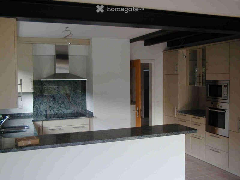 modern kitchen with granite countertops, stainless steel appliances, wooden cabinets, marble backsplash, open layout