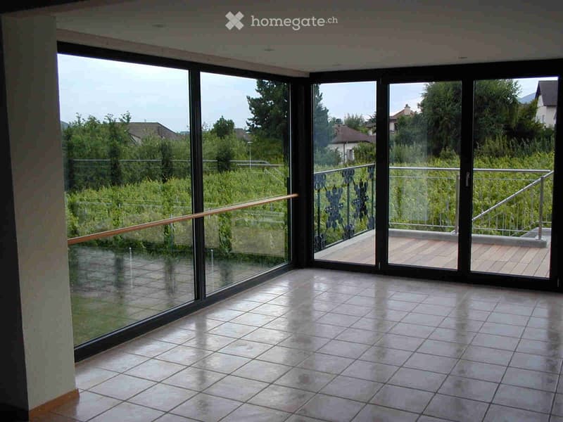 empty room, large glass windows, balcony, tiled floor, metal railings