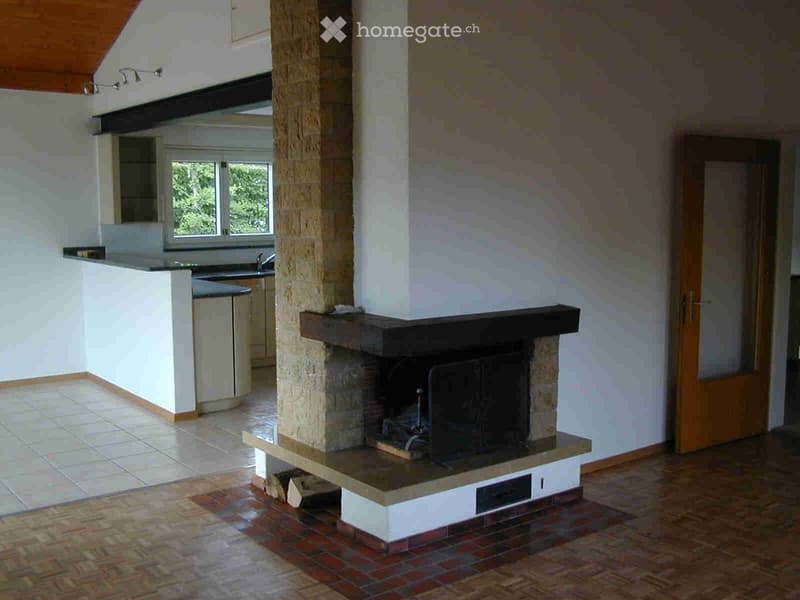 Open living room with fireplace, kitchen, tiled floor, wooden ceiling