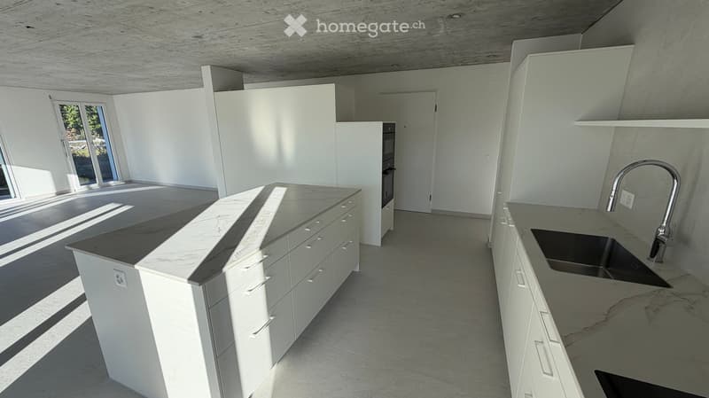 modern kitchen with marble countertops, stainless steel sink, white cabinets, large windows, open layout