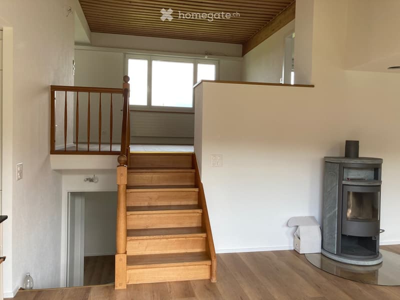wooden stairs, fireplace, white walls, wooden floor