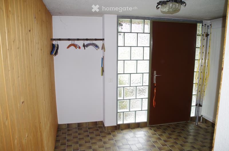 wooden wall, tiled floor, glass door, glass window, coat rack, lamp