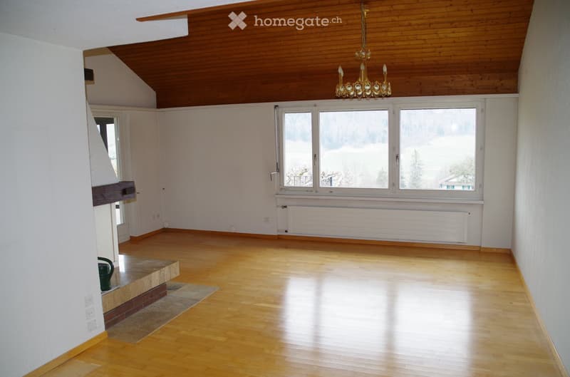 wooden floor, white walls, fireplace, large windows, chandelier