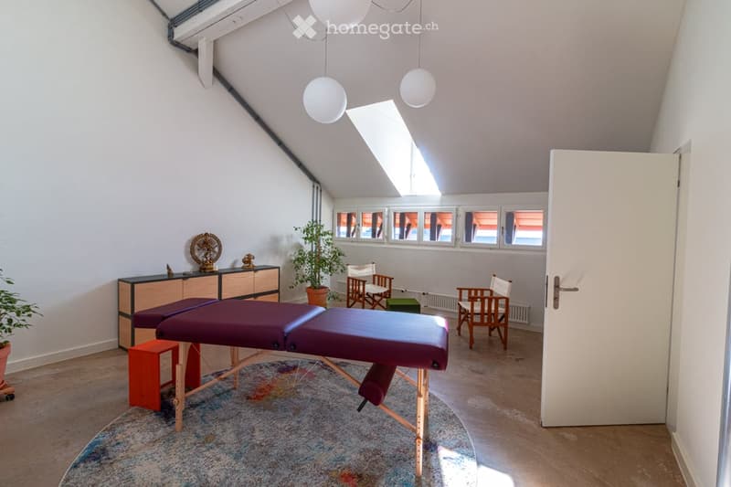 massage table, wooden chairs, wooden cabinet, potted plants, lamps, windows