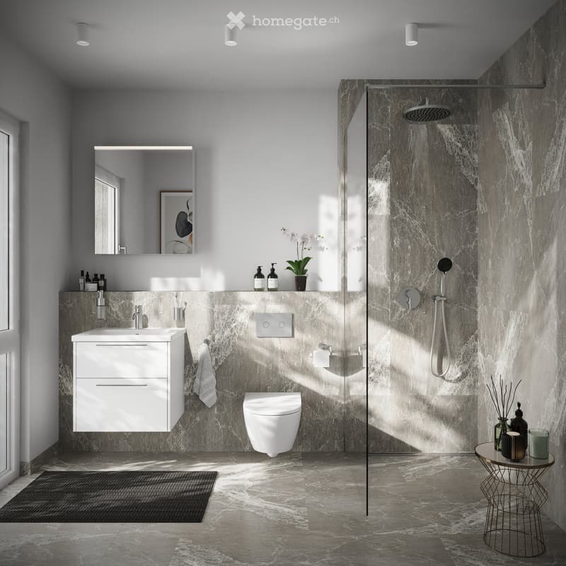 Modern bathroom with white fixtures, marble tiles, glass shower enclosure, white vanity with sink, wall-mounted toilet, and a small table with decorative items.