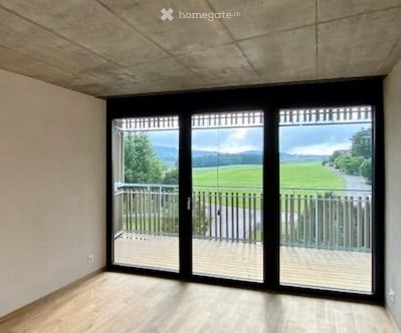 empty room, wooden floor, sliding glass doors, balcony, view of a field