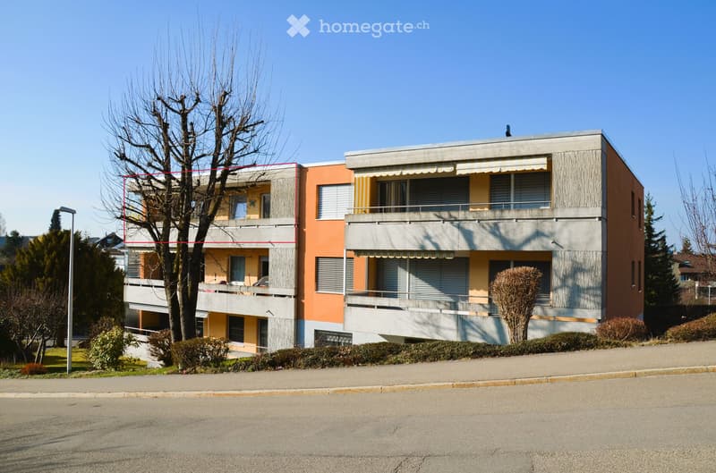 3 story apartment building, balconies, red and yellow facade, street view