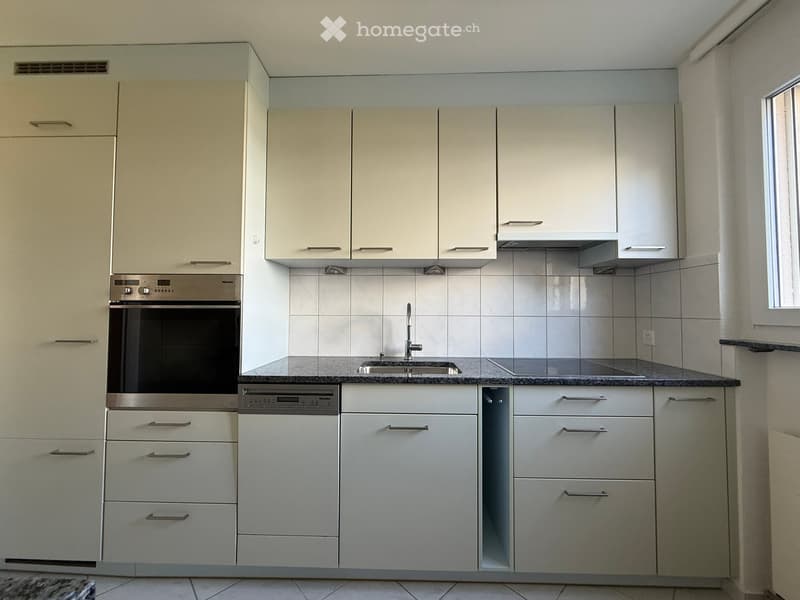 modern kitchen, white cabinets, granite countertop, stainless steel oven, dishwasher, granite flooring