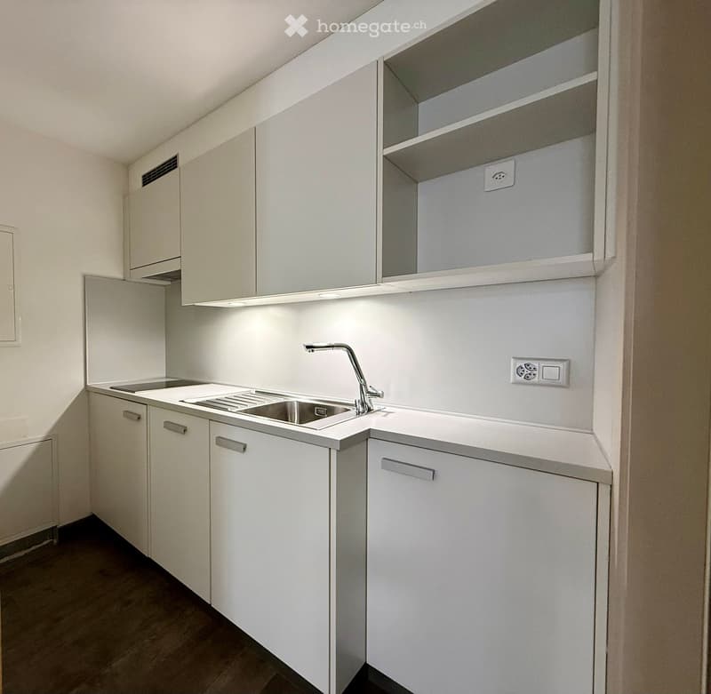 modern kitchen, white cabinets, stainless steel sink, gas stove, dishwasher, electrical outlets