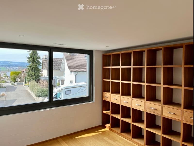large window, wooden floor, wooden shelf, white wall