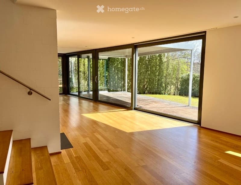 wooden floor, large glass doors, balcony, view of the garden