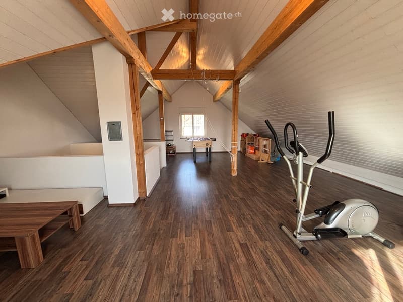 wood floor, wooden beams, white wall, gym equipment, table, window, futon bed