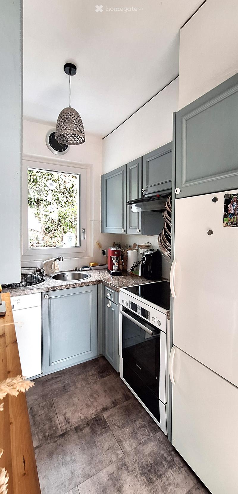 kitchen with granite countertop, white appliances, gray cabinets, sink, dishwasher, washing machine, oven, refrigerator, coffee machine, clock, window