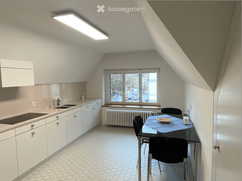 modern kitchen with dining area, white cabinets, hexagonal tiles, induction cooktop, sink, window with view