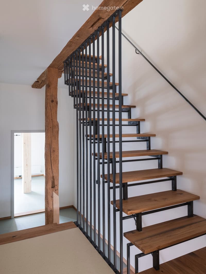wooden staircase with metal railings, wooden steps, modern design