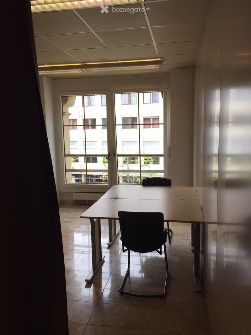 empty room, two tables, two chairs, glass door, windows, tiled floor, white walls
