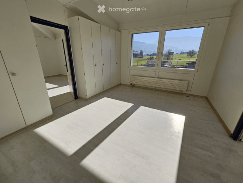 empty room, white walls, white floor, large window, wardrobe