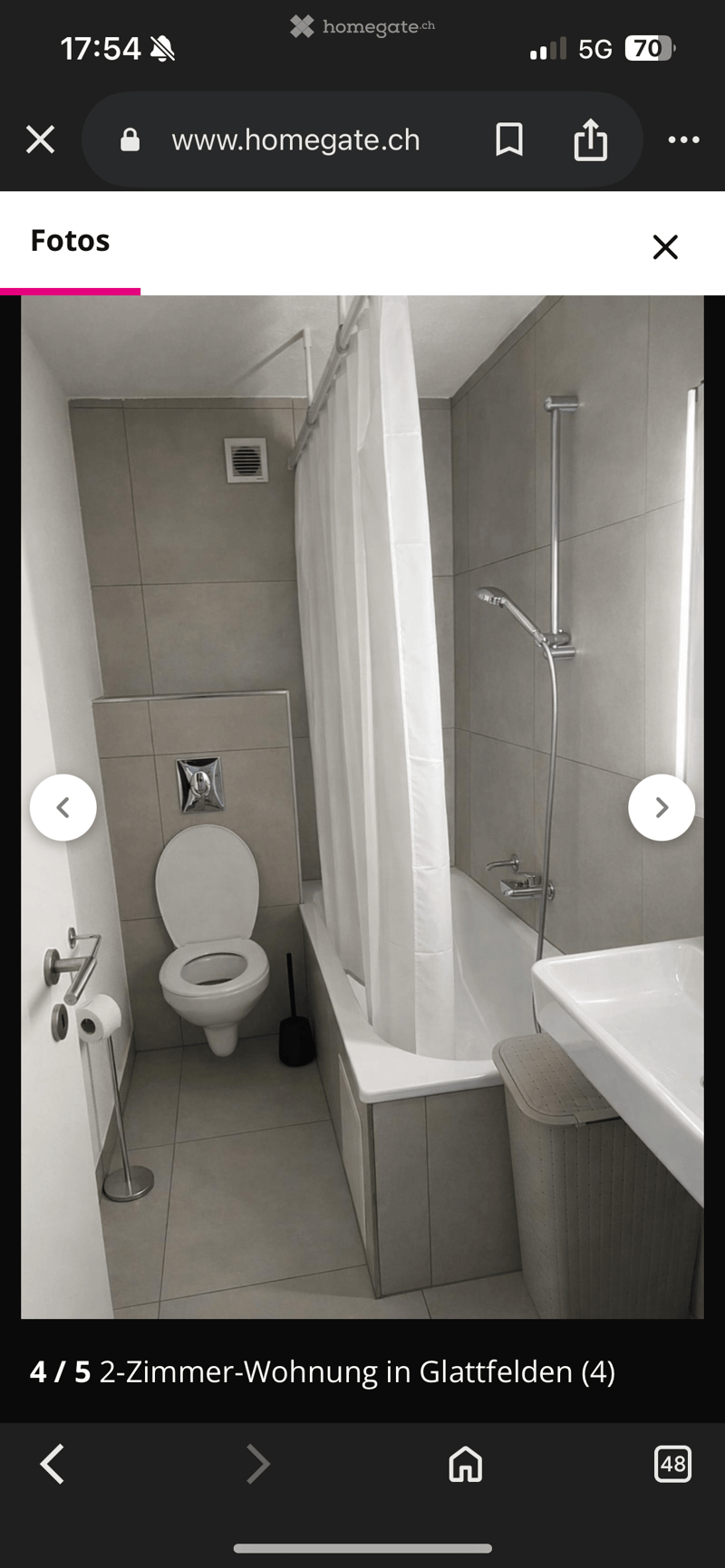 Bathroom with bathtub, shower, toilet, sink, and towel holder