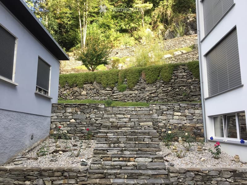 stone wall, steps, gravel, plants, flowers, trees