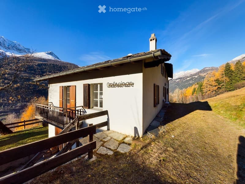small house, white exterior, wooden balcony, mountain view