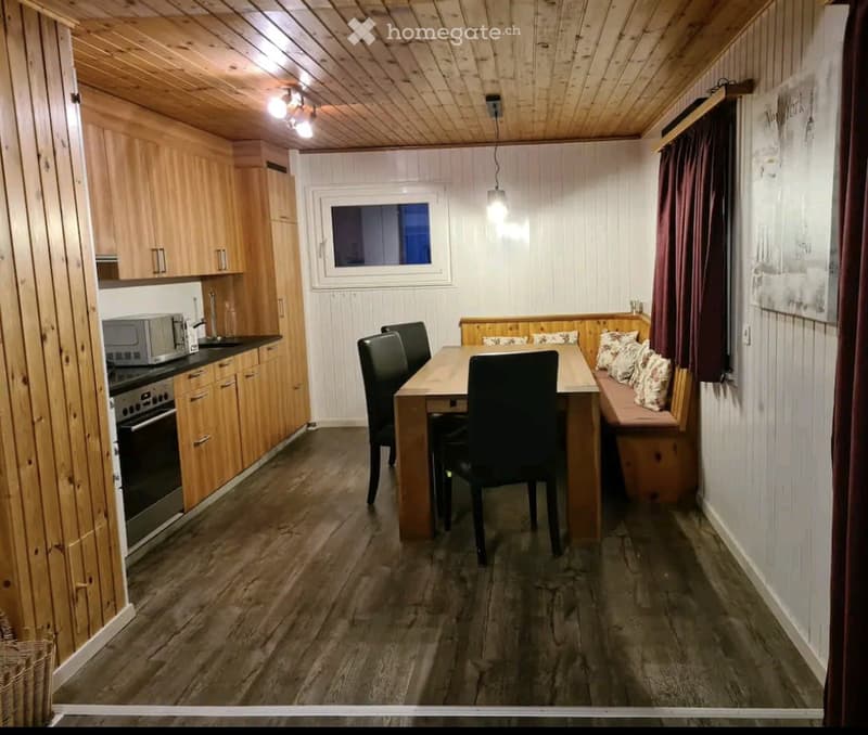kitchen with dining area, wooden cabinets, microwave, oven, dining table, bench, wooden floor, wooden ceiling