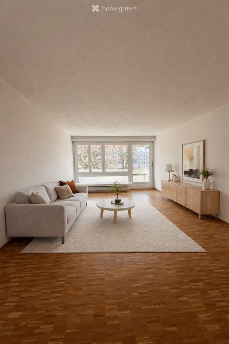 modern living room with white walls, wooden floor, large windows, couch, coffee table, side table, and a wooden cabinet with a plant
